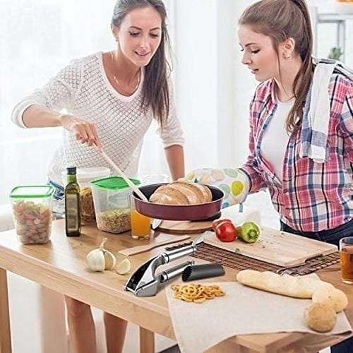 Women Cooking with Garlic Press