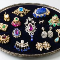 a collection of colorful, ornate vintage costume jewelry